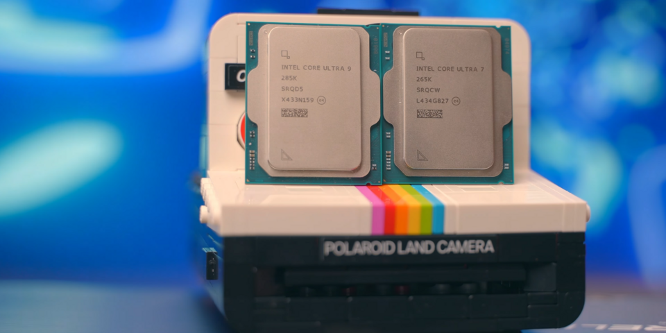 Intel Core Ultra 7 265K with SRQCW marking on the right, beside a 285K on the left, resting on a camera
